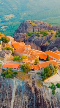 Vertical video. Meteora, Kalabaka, Greece. Monastery of the Transfiguration of the Saviour. Meteora - rocks, up to 600 meters high. There are 6 active Greek Orthodox monasteries listed on the UNESCO 
