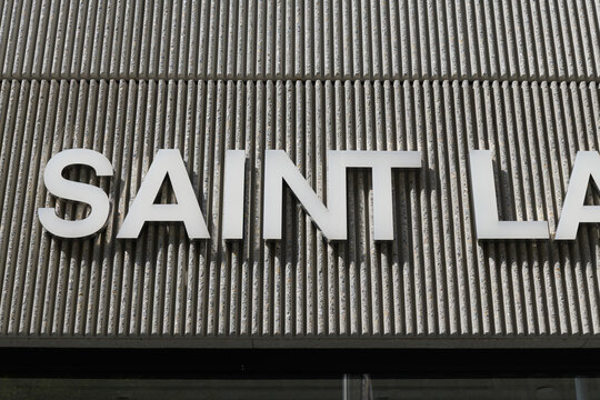 exterior building facade and sign of Saint Laurent, a high end designer clothing store, located here at 110 Bloor St W, Toronto
