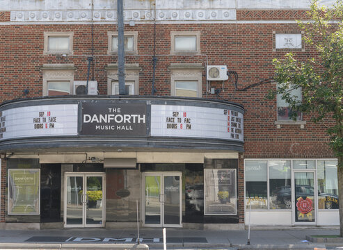 exterior building facade and signage of Danforth Music Hall, a live music venue, located at 147 Danforth Av, Toronto