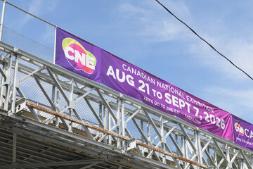 Obraz premium banner on exterior side of a footbridge over Lake Shore Blvd W for the CNE, or Canadian National Exhibition, 2026, Toronto