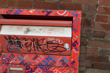Obraz premium brick wall and Canada Post street letter box front side with flap (postal-code wrap), Toronto