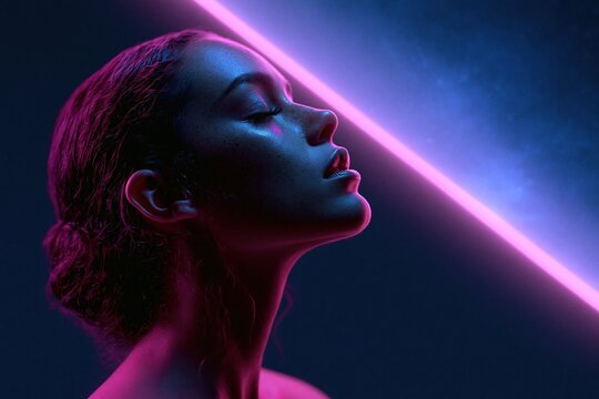 Dramatic side profile of a woman with tied dark hair beneath a diagonal pink neon tube and blue atmospheric light Expression of futuristic serenity