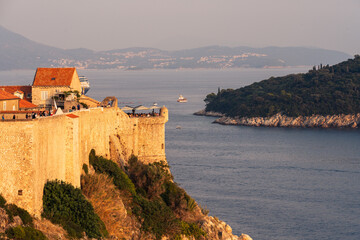 Dubrovnik city walls and turret overlooking Lokrum island © Yuxiao