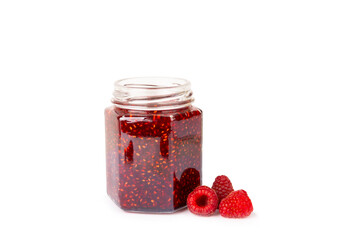 A jar of raspberry jam isolated on white background. A bowl of sweet berry jam. fruit spread texture, red jam splatter, organic dessert topping. clipping path © Avocado_studio