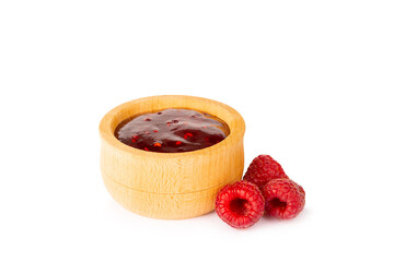 A jar of raspberry jam isolated on white background. A bowl of sweet berry jam. fruit spread texture, red jam splatter, organic dessert topping. clipping path © Avocado_studio
