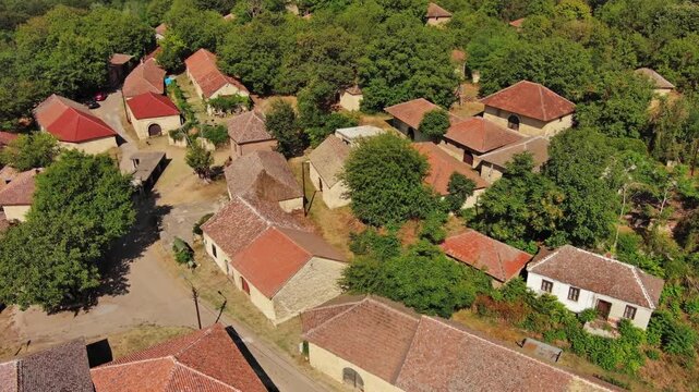 Aerial around view of old rustic vintage houses with wine cellars in Rogljevacke pivnice in Negotin region of Serbia, 4k