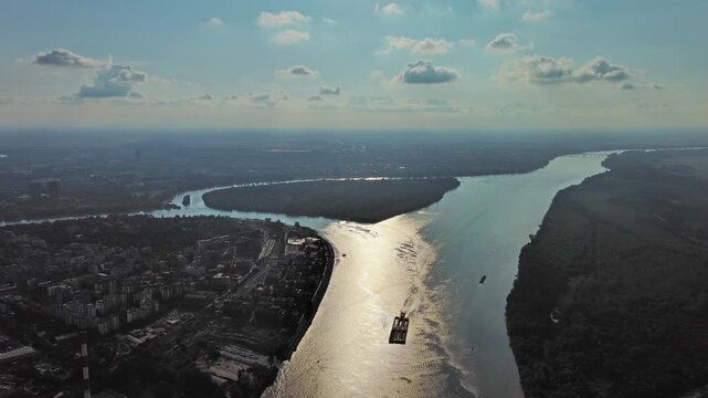 Aerial view of Belgrade at confluence of Sava and Danube rivers. Urban landscape, forested river island and city view, 4k