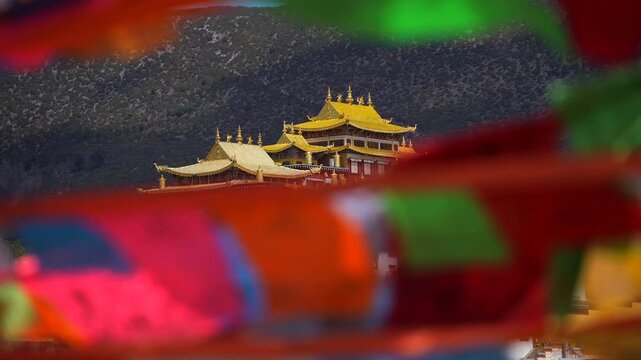 Tibet Songzanlin Lamasery in Shangri-la, Yunnan, China. Traditional Tibetan architecture Monastery on Hill, Prayer Flags