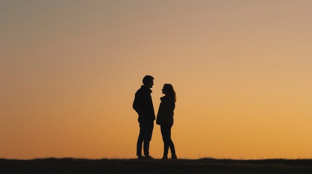 Emotional Silhouettes at the Horizon &mdash; two people stand close together, their quiet body language against a bright horizon expressing connection, emotion, and peaceful intimacy.