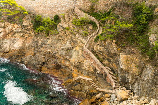 Spain, Catalonia, Costa Brava, Sa Tuna.  Coastal footpath with many stairs.