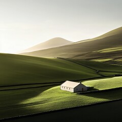 Obraz premium Lone farmhouse nestled in serene rolling green hills under a bright sky