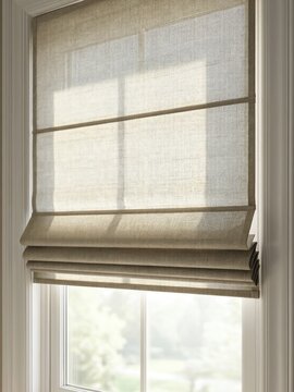 Natural light shines through a woven window shade in a home setting during the day