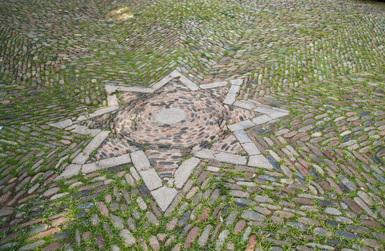 Spain, Catalonia, Girona.  Elaborate mosaic 8 sided star in the roadway.  