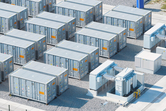 Aerial view of battery energy storage system facility for renewable power plant. Industrial lithium batteries used for clean electricity grid management.