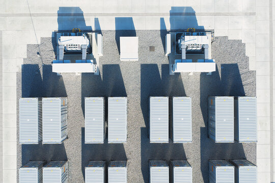Aerial view of battery energy storage system facility for renewable power plant. Industrial lithium batteries used for clean electricity grid management.