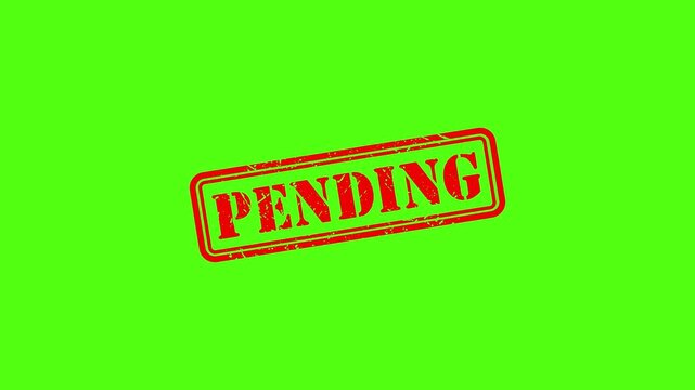 Red pending rubber stamp impression on green screen background, for business approval, status