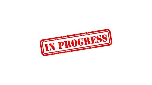 Red rubber stamp impression with in progress text isolated on white background