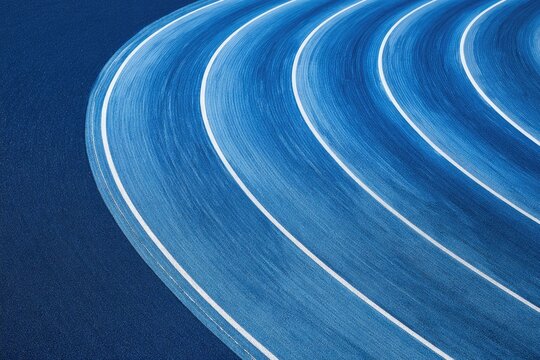 Abstract blue track with curving white lines