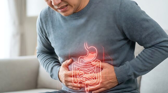 Man suffering from severe stomach pain with a glowing red highlight on his abdomen representing digestive health issues