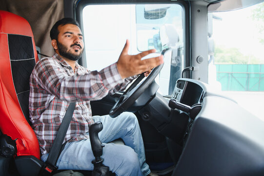 Truck driver gesticulating while explaining inside cabin