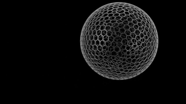 A stunning video showcasing a futuristic honeycomb sphere rotating against a sleek black background