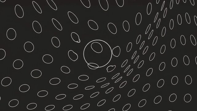 A video showcasing a mesmerizing pattern of white ovals on a black background, creating a visually striking design.