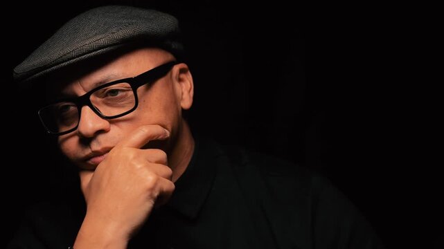 Black man thinking pose off to the side