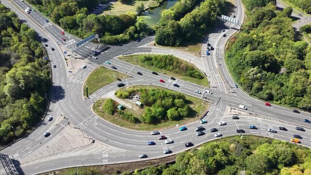 Drone Aerial Footage of Busy Roundabout Traffic in Basingstoke UK Road Infrastructure