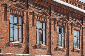Four windows of the old mansion 19 century with brown bricks wall © Dmitrii Potashkin