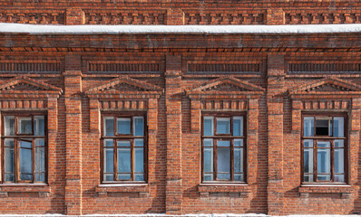 Four windows of the old mansion 19 century with brown bricks wall © Dmitrii Potashkin