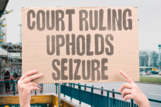 "Court ruling upholds seizure" Judge affirms government authority to confiscate digital property. LEGAL. COURT. DECISION. AUTHORITY. PROPERTY.