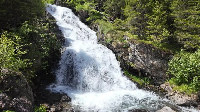 Nature mountain landscape. Rocky water landscape. Nature wildness. Rapid waterfall travel destination. Picturesque waterfall. Travel destination. Scenery waterfall route. Rushing waterfall