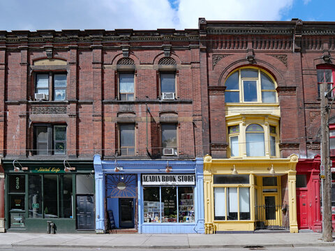 Old main street buildings in Toronto, with stores on the ground floor, a listed heritage building constructed in 1889