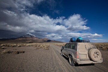 Off road 4x4 car driving on dirt road in Bolivia desert mountains landscape  © younsse