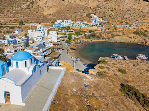 View of sea bay with beautiful beach and traditional church on Karpathos island in Foiniki village, Greece