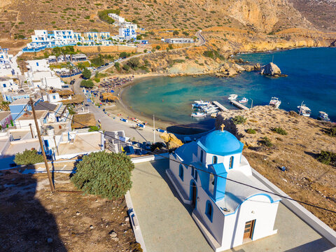 View of sea bay with beautiful beach and traditional church on Karpathos island in Foiniki village, Greece