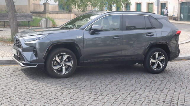 CASTELO BRANCO, PORTUGAL - AUGUST 22, 2026: General view of Castelo Branco city in the Beira Baixa region of central Portugal Modern Grey Toyota RAV4 Plug In Hybrid SUV parked on cobblestone street