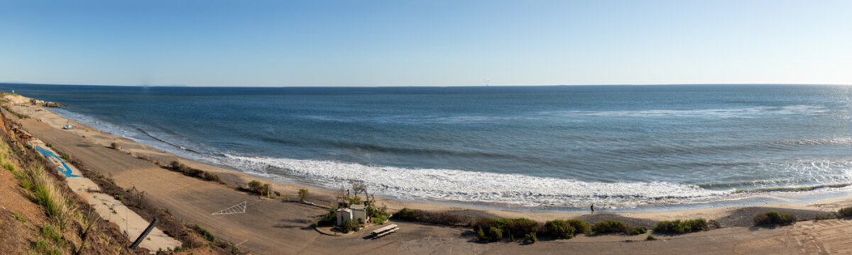 people enjoy beautiful scenic beach in Malibu, California with promenade street and protected beach, USA