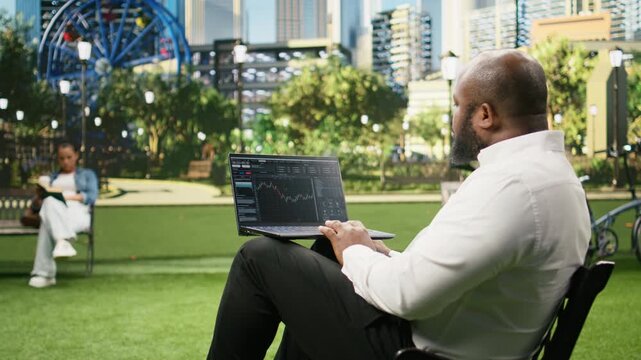 Businessman studying financial trading charts on forex platform