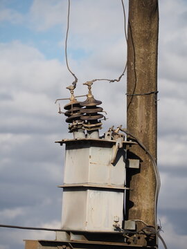Pole Mounted Electricity Transformer Unit on Wooden Utility Power Pole
