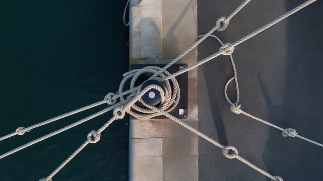 Mooring ropes on a harbour bollard