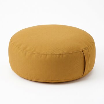 A round, mustard yellow meditation cushion or zafu on a white background, perfect for yoga and mindfulness practices.