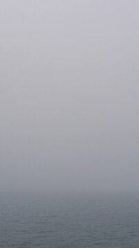 Foggy Sea Horizon on Calm Misty Morning