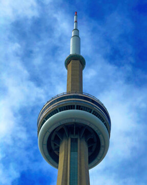 The CN Tower in Toronto, Ontario Canada. This striking photograph captures the CN Tower soaring into a vivid summer sky above Toronto, Canada. 