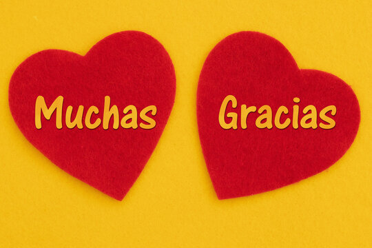 Thank you card Gracias Spanish message with 2 red hearts on bright yellow felt