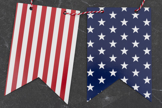 Blue and white star and red striped pennant banner on stone for festive events
