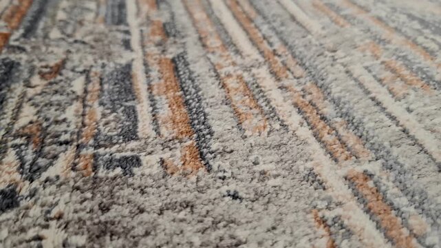 Striped multicolor carpet texture in close view. Interior textile, abstract pattern, home decor, soft surface, flooring design.