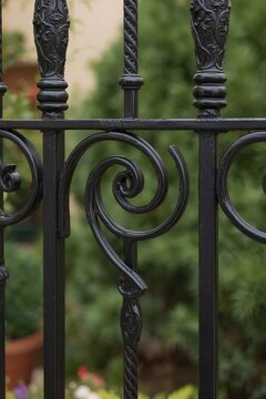 Wrought iron decorative fence design with swirl patterns  