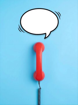 Red retro telephone handset with an empty speech bubble on a vibrant blue background for communication concepts.