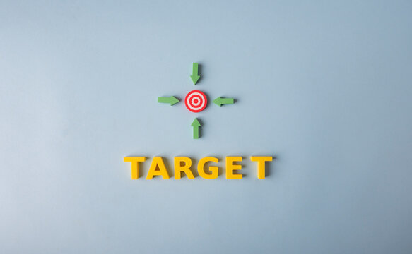 Target achievement, goal focus and strategic direction concept with arrows pointing to bullseye
